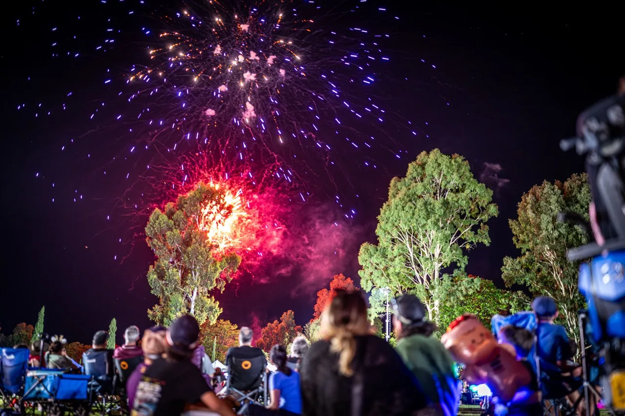 Fireworks over a Christmas celebration crowd