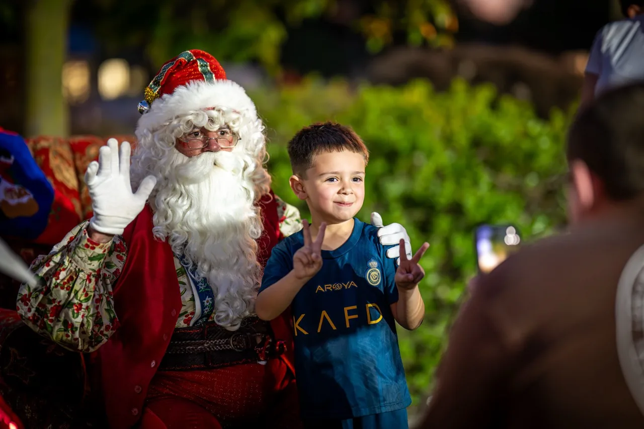 Santa with a child at a Christmas event