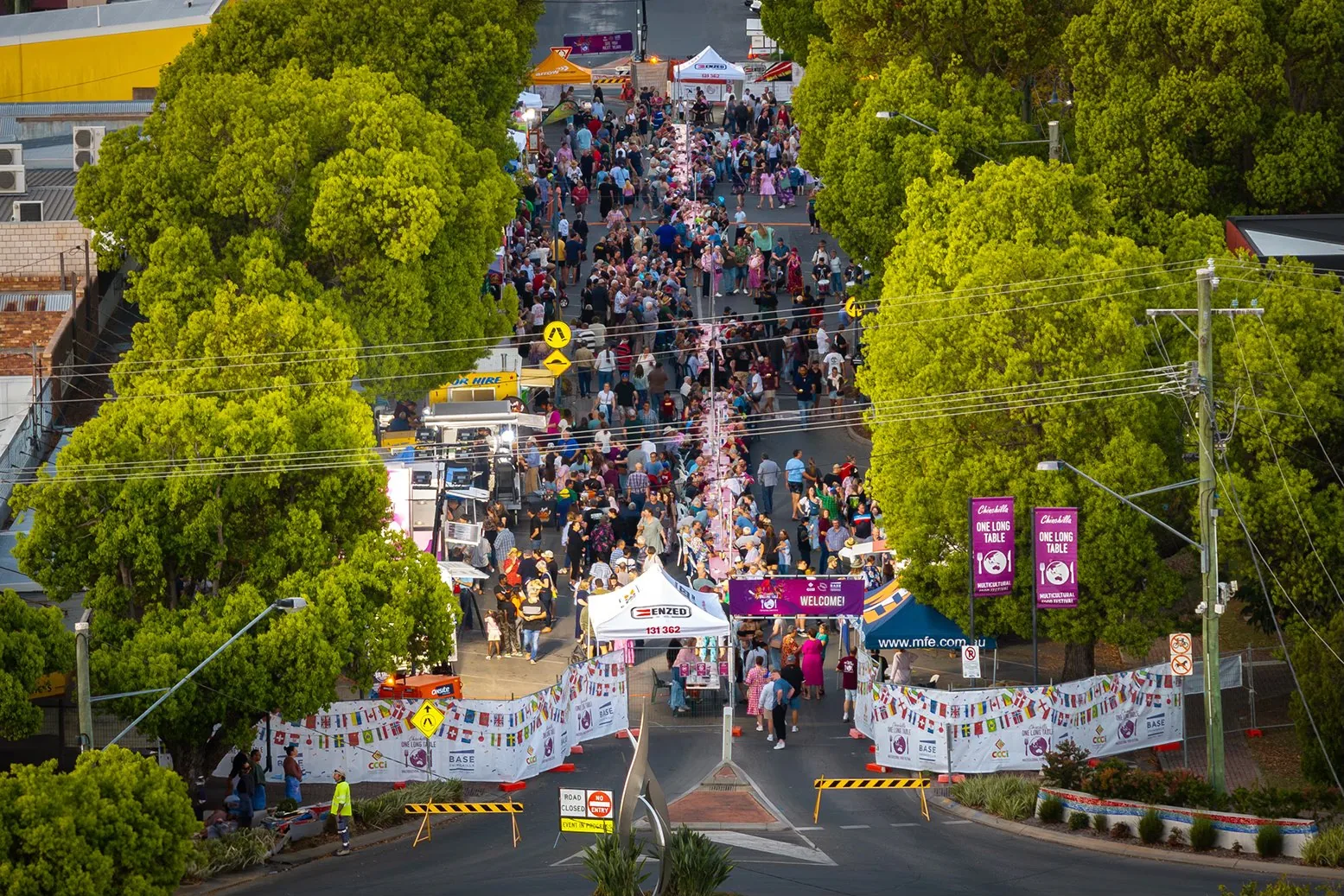 An aerial view of a crowded street festival