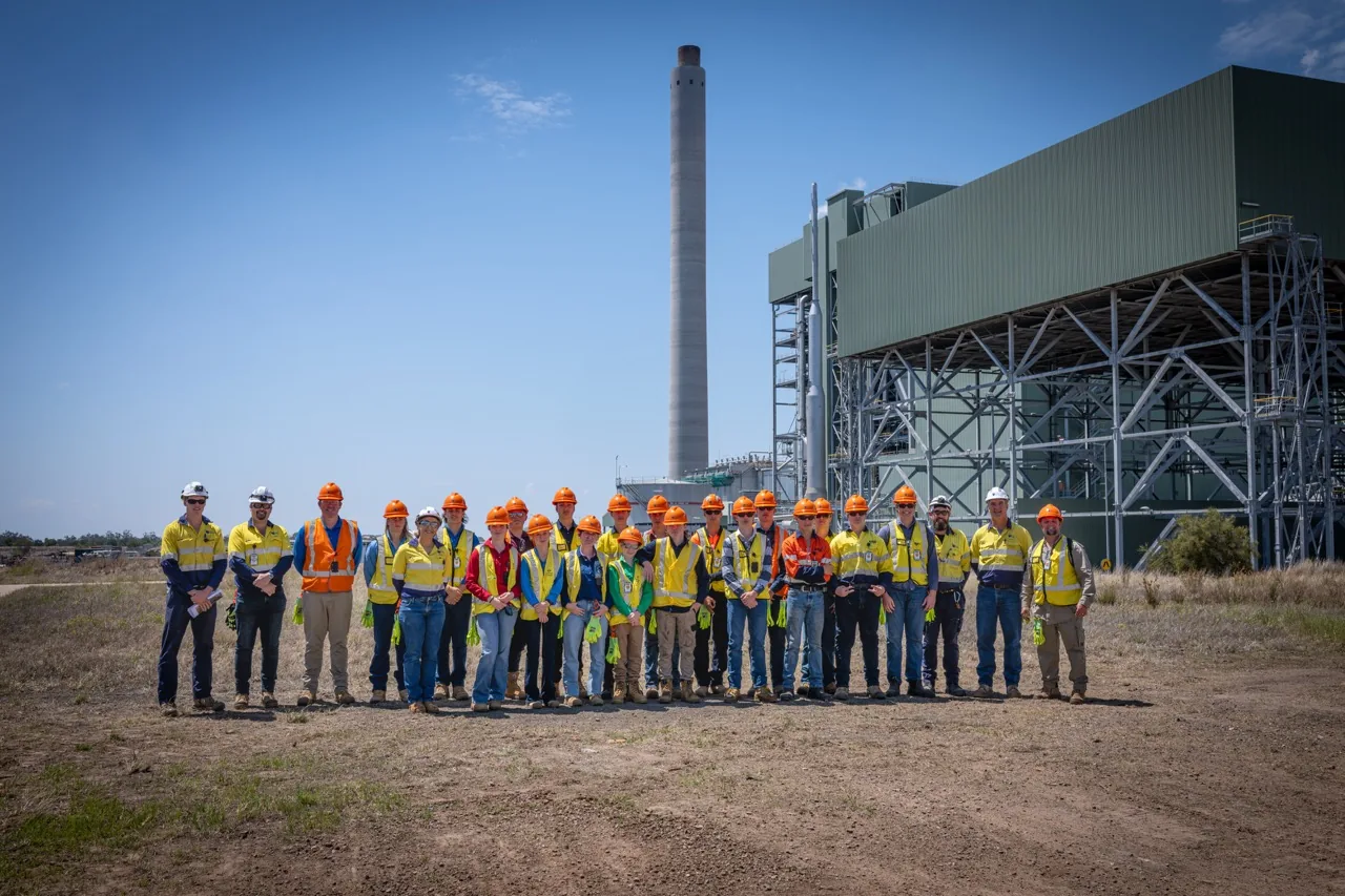 A group in high-visibility workwear on an industrial site