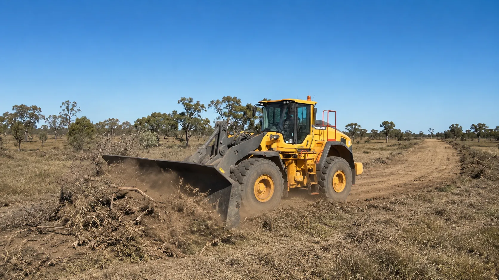 A loader cutting a fire break