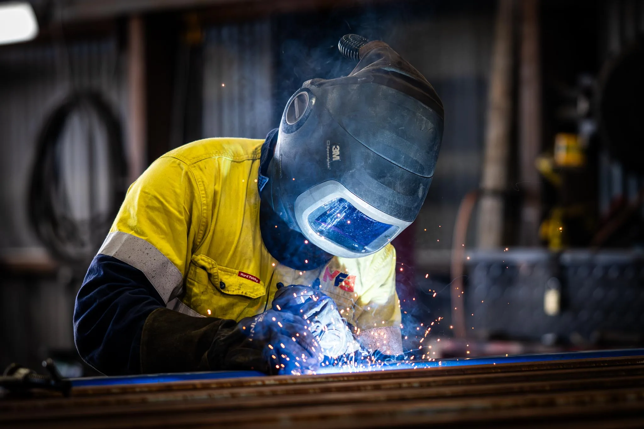 Gerkies commercial production: a welder at work, sparks in frame