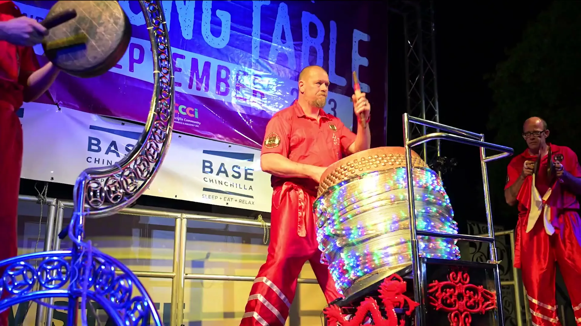 A drummer performing on the One Long Table stage