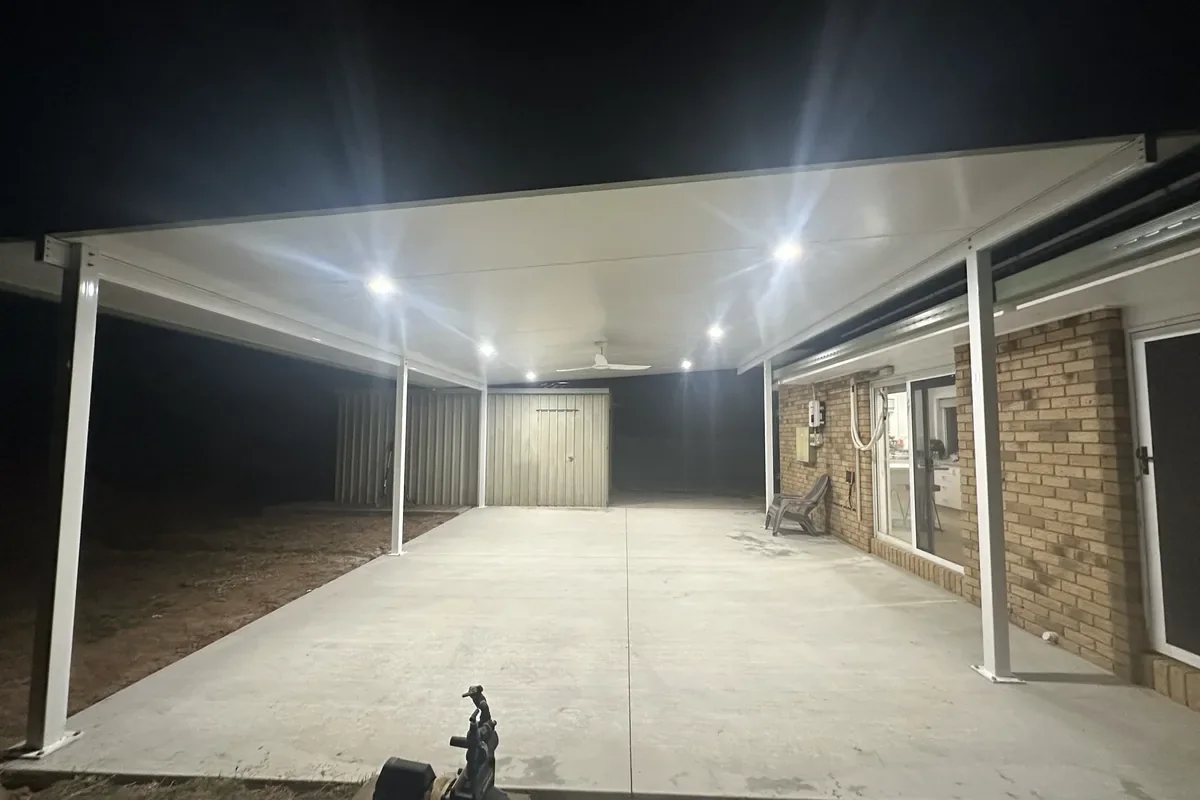 A new patio and carport lit end to end after dark